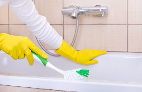 Local technician cleaning a sofa in an Enfield property